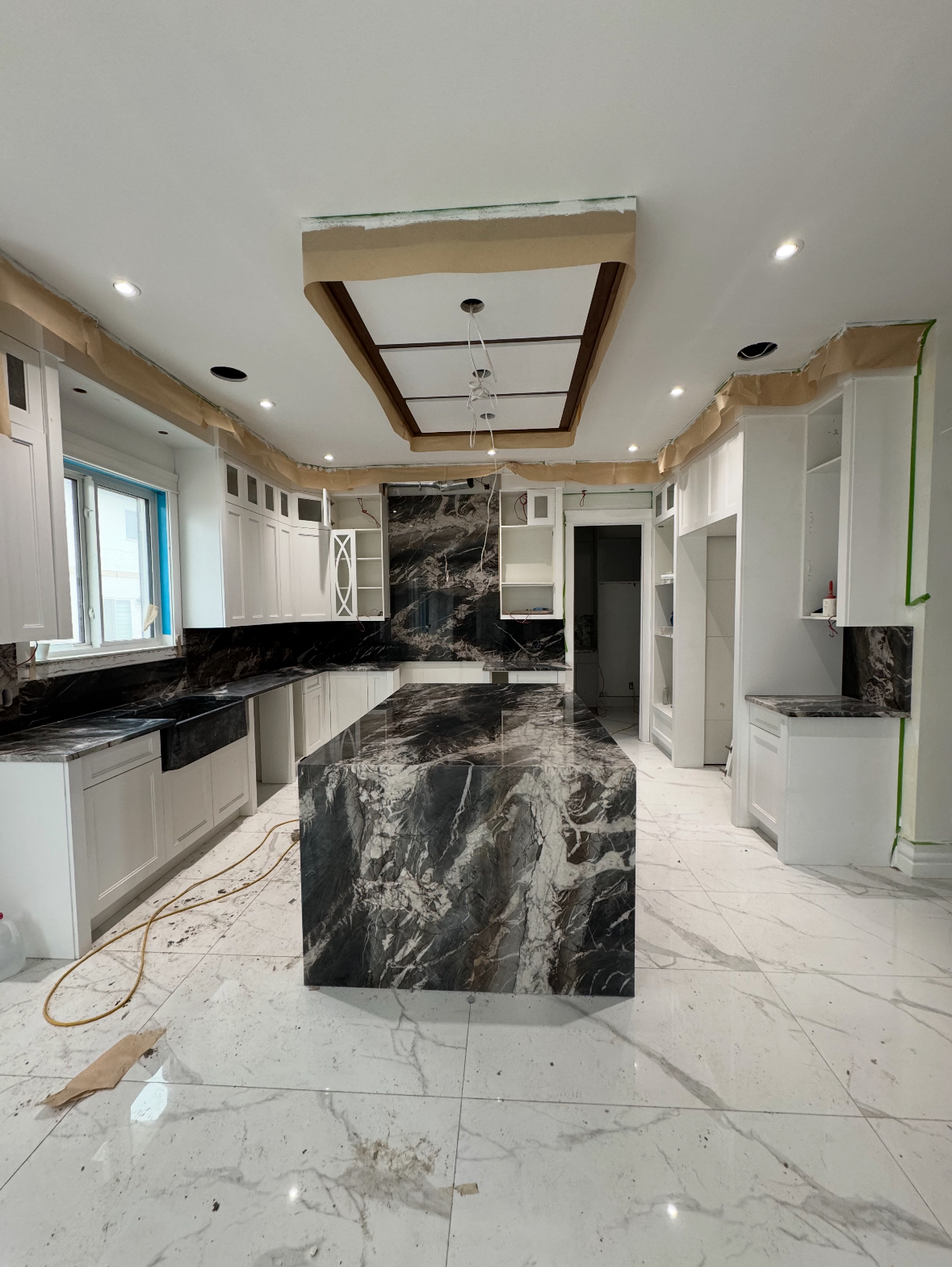 Custom kitchen with dramatic dark marble island